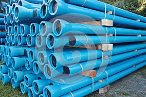 Blue PVC plastic pipes and fittings used for underground water supply and sewer lines