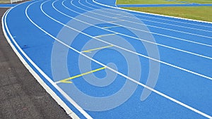 Blue race stadium and running track curve detail for outdoor athletics sport