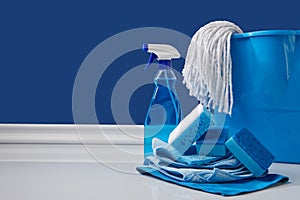 blue rags, bucket and spray