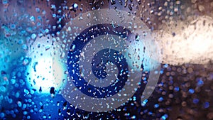 Blue Rain Drops On Window Glass