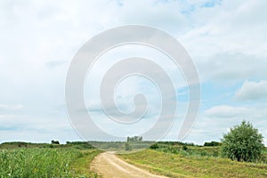 Blue rainy clouds over country road