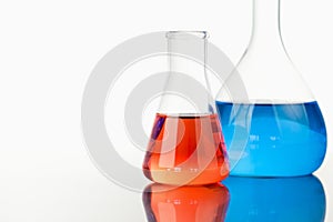 Blue and red beakers