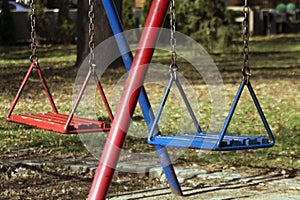 Blue and red children`s swing