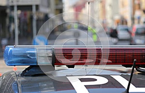 Blue and red flashing sirens of police car during the roadblock