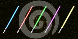 Blue, red, green, pink and yellow laser sword lightsaber set isolated on starry black galaxy background. May the 4th be photo