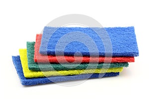 Blue, red, green and yellow abrasive pads
