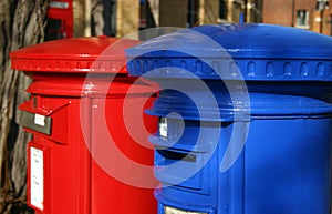 Blue and red post boxes