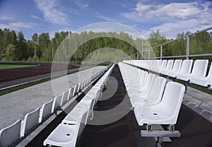 Blue, red, white rows of seats on the stadium