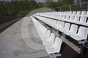 Blue, red, white rows of seats on the stadium
