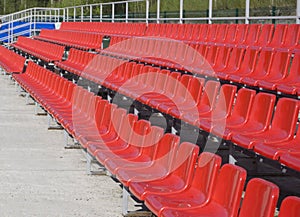 Blue, red, white rows of seats on the stadium