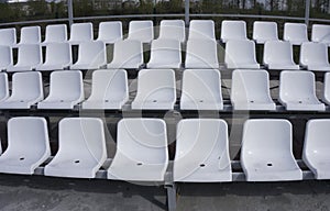 Blue, red, white rows of seats on the stadium