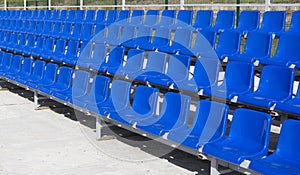 Blue, red, white rows of seats on the stadium