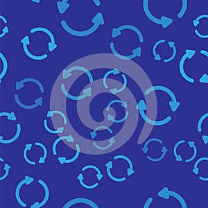 Blue Refresh icon isolated seamless pattern on blue background. Reload symbol. Rotation arrows in a circle sign. Vector