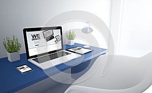 blue responsive studio with we design devices