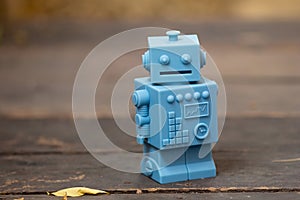 Blue Retro robot toys on wood floor pattern in Natural background