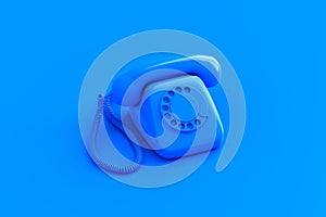 Blue retro rotary dial telephone on color background