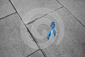 Blue ribbon on gray stone, prostate cancer