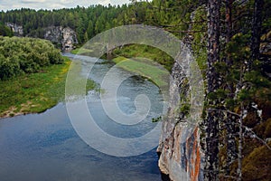 The blue ribbon of the river from the height of the mountains. Wild nature, taiga. Tourism. Far East, Sakhalin Island, Russia.