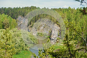 The blue ribbon of the river from the height of the mountains. Wild nature, taiga. Tourism. Far East, Sakhalin Island, Russia.