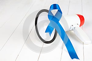 Blue ribbon symbolic of prostate cancer awareness campaign and men`s health in November