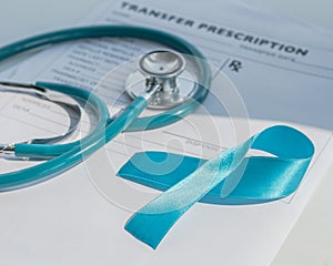 Blue ribbon symbolic of prostate cancer awareness campaign and men`s health in November month on  patients health record