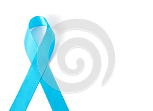 Blue ribbon on white background prostate cancer awareness concept