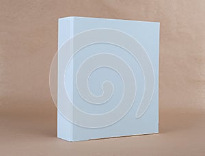 A blue ring binder on beige background.