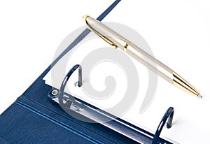 Blue ring binder and pen