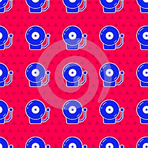 Blue Ringing alarm bell icon isolated seamless pattern on red background. Alarm symbol, service bell, handbell sign