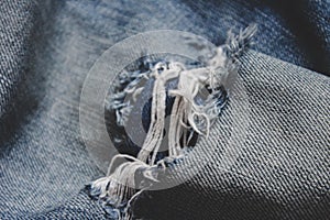 blue ripped jeans closeup picture