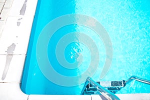Blue ripped water in swimming pool. Surface of blue swimming pool, background of water in swimming pool