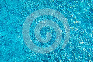 Blue ripped water in swimming pool. Surface of blue swimming pool, background of water in swimming pool. Water swimming pool