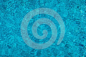 Blue ripped water in swimming pool. Surface of blue swimming pool, background of water in swimming pool. Water swimming pool