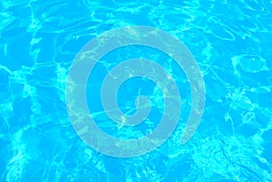 Blue ripped water in swimming pool . texture pool . Shining blue water ripple background
