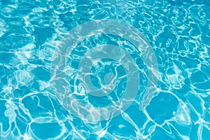 Blue ripped water in swimming pool. water surface background.