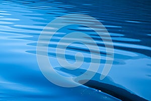Blue rippled water as abstract background