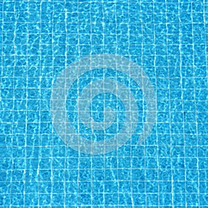 Blue rippled water background in swimming pool