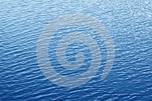 Blue rippled water surface. Water background