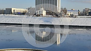 Blue river after ice drift. Small pieces of ice float on the river. .