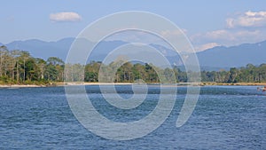 Blue river, blue mountains, blue skies