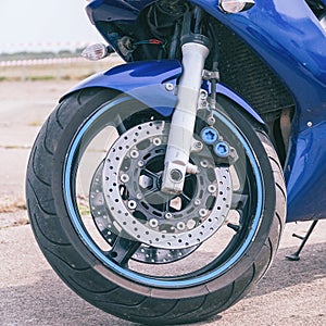 Blue road bike front wheel with disc brake