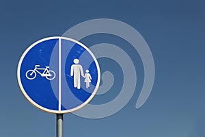 Blue road sign for bicycle and pedestrian