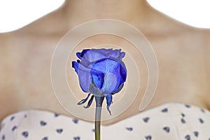 Blue rose and decollete woman photo