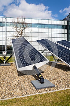 Blue rotating solar panels tilted axis tracker, future energy concept