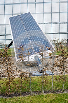 Blue rotating solar panels tilted axis tracker, future energy concept