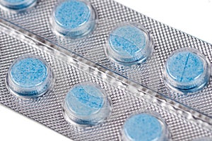 Blue round pills in blister