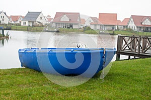 Blue rowboat on the lake on vacation