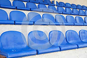 Blue rows of seats in a sports hall. Stadium seating. Empty rows of chairs, seats in the concert hall, in the sports hall