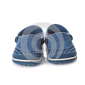 Blue rubber kid's clogs isolated on white background