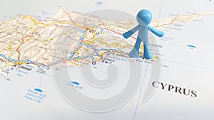 A blue rubber man overlooking Ayia Napa on a map of Cyprus
